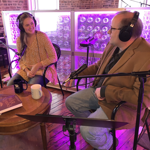 photo of student Emily Jordan recording podcast with her father