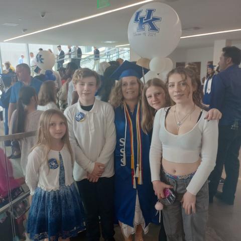 Alexandrea Shouse walked across the stage Dec. 20 surrounded by her kids. Photo provided. 