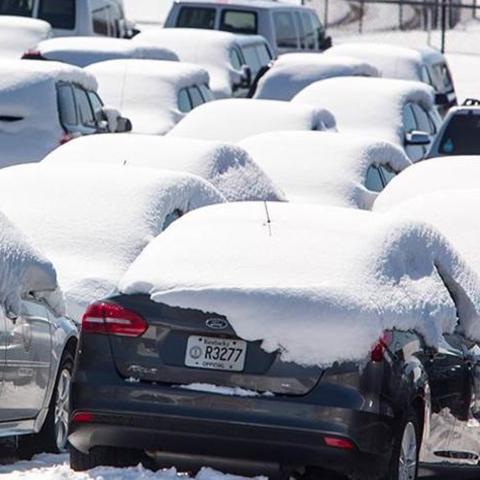 Cars in the UK motor pool covered in snow