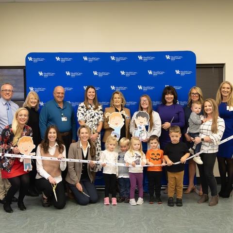 Image of group of people cutting a ribbon