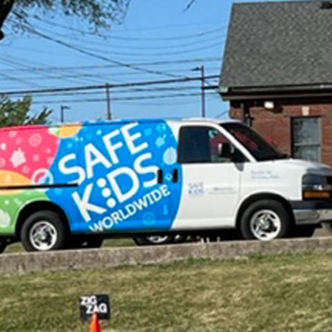 image of safe kids van parked next to bike training course