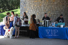 A photo of UKPD and the VIP center tabling, providing resources to students and chatting.