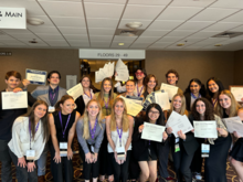 Students standing with their awards. 