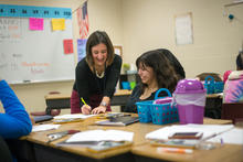A teacher instructing another teacher.