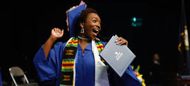 This is a photo of a new UK graduate at Commencement. 