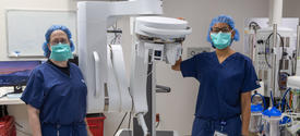 Image of two surgeons with the SP surgical robot