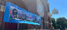 Unity in the Community event poster hung on railing of First Baptist Church Frankfort