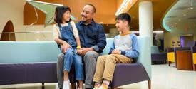 Image of family sitting in the lobby of Kentucky Children's Hospital