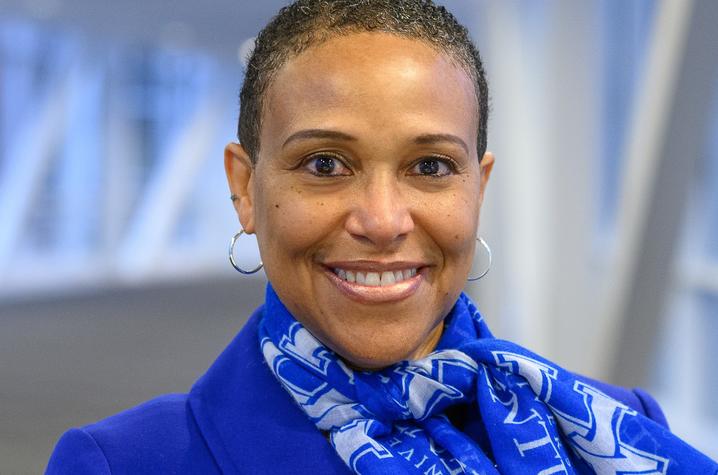 Tukea Talbert headshot with UK scarf