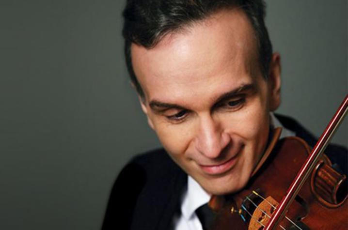 headshot photo of Gil Shaham playing violin