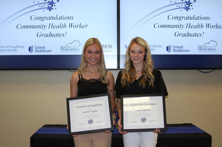 Jazmen Fugate and Jayla Ledford holding certificates