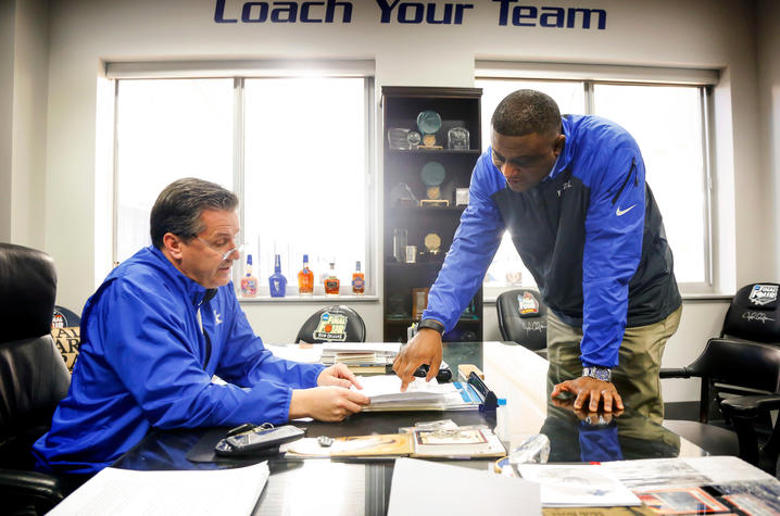 This is a photo of John Calipari (L) and DeWayne Peevy (R).