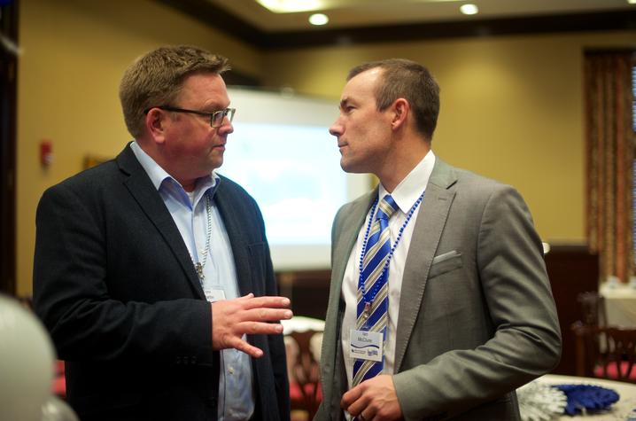 Tom Martin of EKU, left, talks with UK's Ian McClure