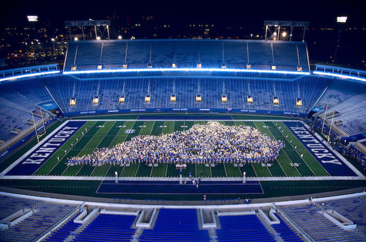 photo of people standing in shape of Kentucky