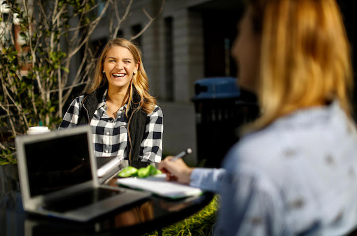 photo of girls with laptop