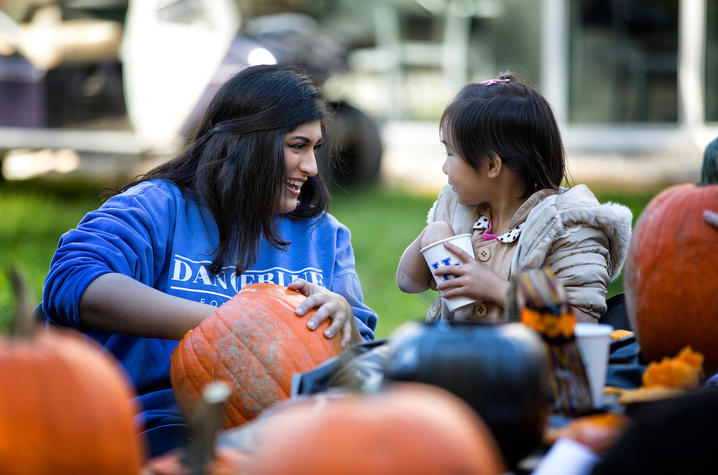 photo of student carving pumpkin