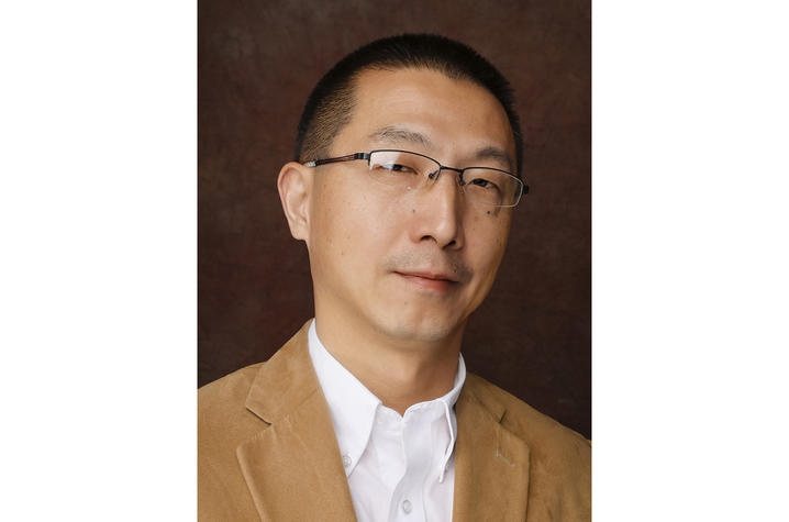 headshot photo of Z. George Zhang
