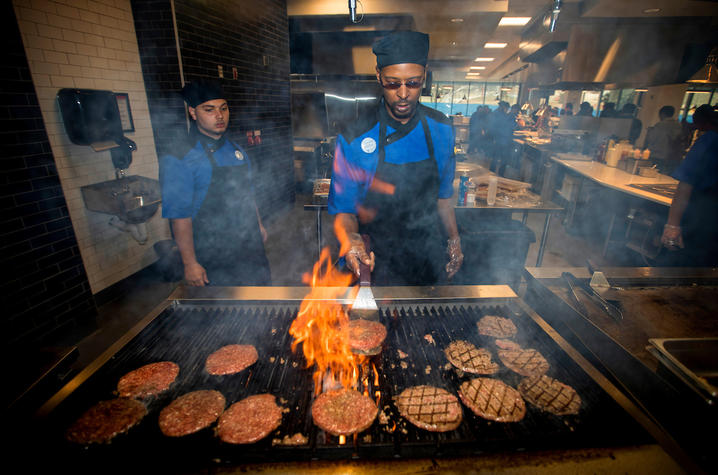 This is a photo of chefs in action at Champions Kitchen.