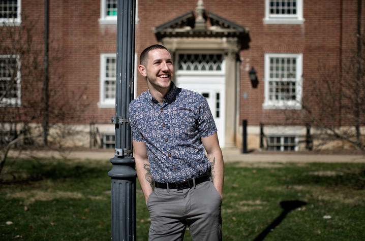 Photo of Trey Cardwell stands leaning in front of a brick building in the Breckinridge Courtyard Photo by Mark Cornelison | UK Photo