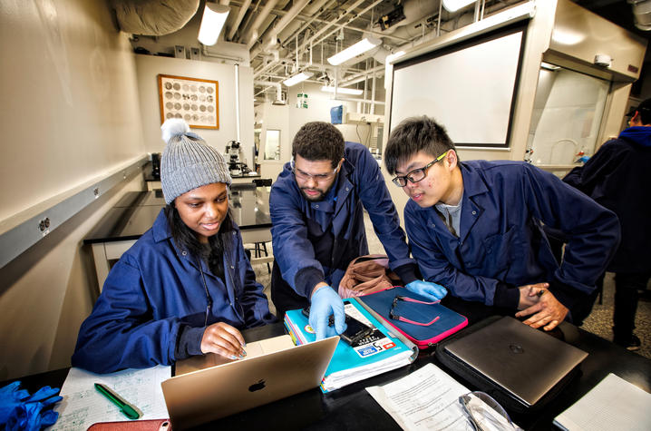 This is a photo of UK College of Engineering students working together on a project. 