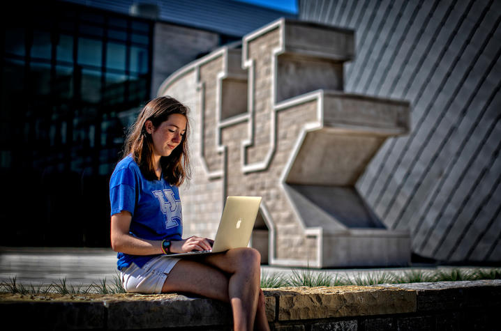 Photo of student in front of student center 