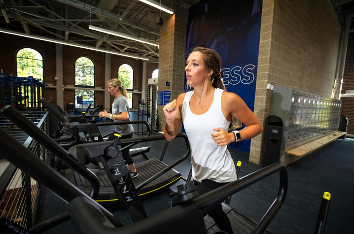 photo of women on treadmills - Alumni Gym