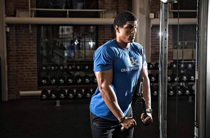 photo of man working out in Alumni Gym