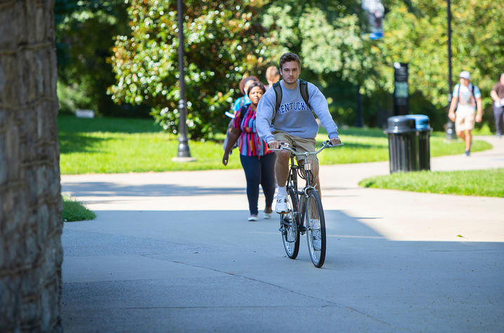 Photo of student riding a bicycle 