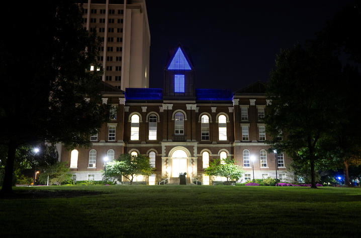 photo of Main Building lit in blue