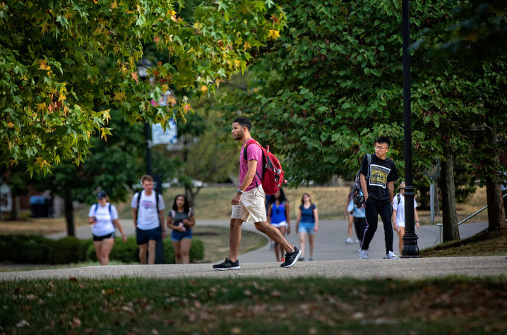 Photo of student walking on campus