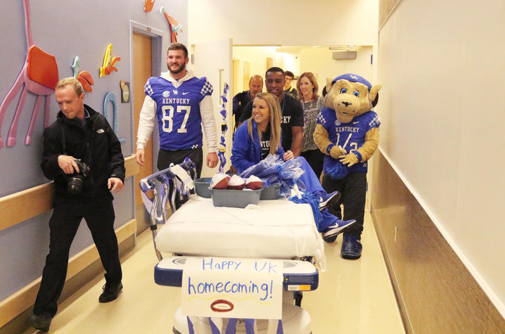 CJ and the cheerleaders made a parade float out of a stretcher