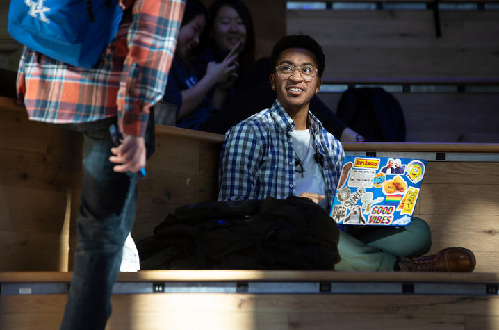 student sitting with a laptop