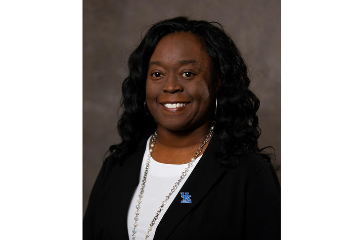 Thalethia Routt headshot wearing black jacket and white shirtr