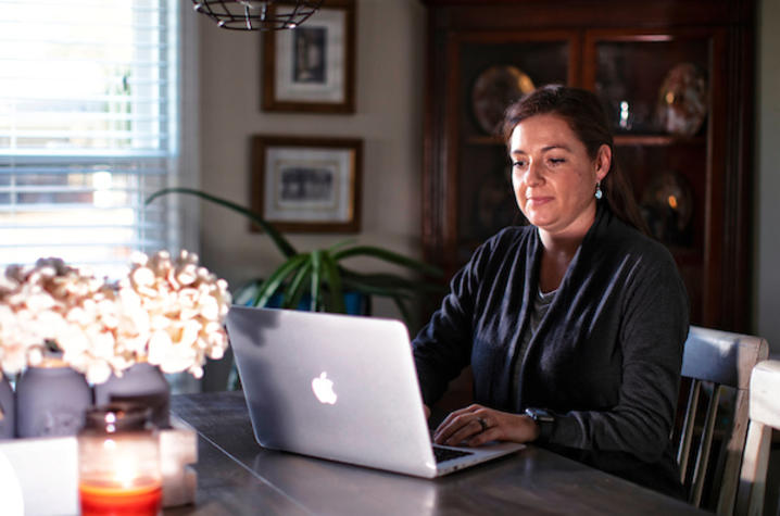 Photo of employee on computer at home