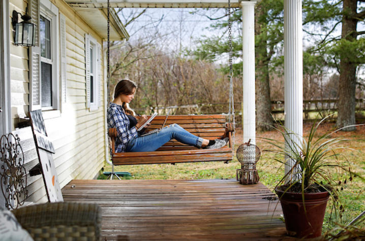 Photo of girl sitting on swing