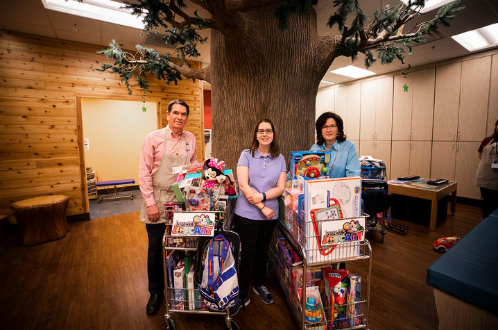 Doug, Claire and Jennifer Mynear with the joy cart 