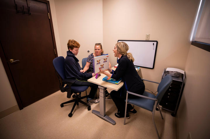 Corie Sexton works with Gray McClanahan on language exercises | Photo: Pete Comparoni