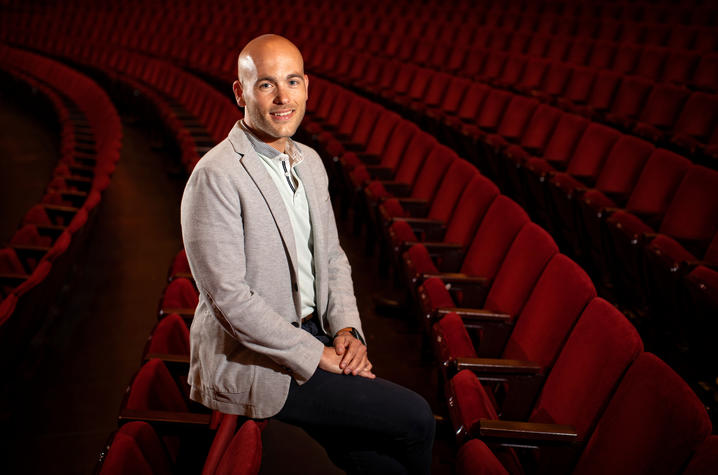 photo of Nick Covault leaning on chairs in Whitney Hall