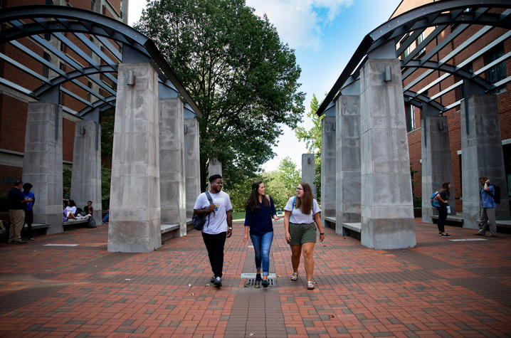 photo of 3 students walking in Engineering quad