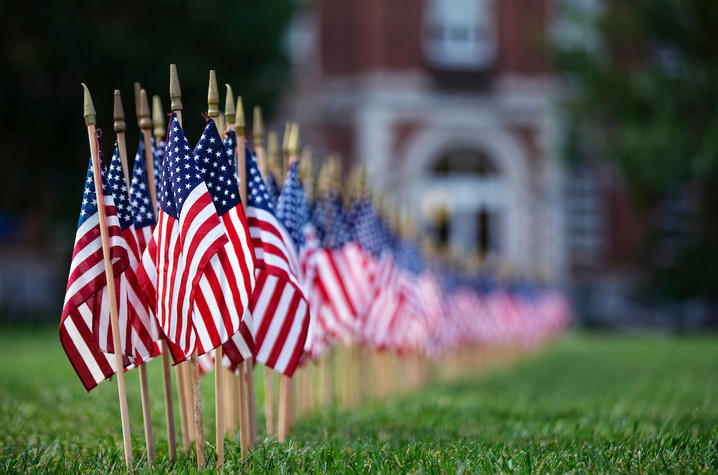 photo of 9/11 flags in front of UK Main Building