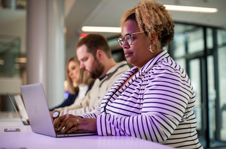 Photo of woman using a computer.