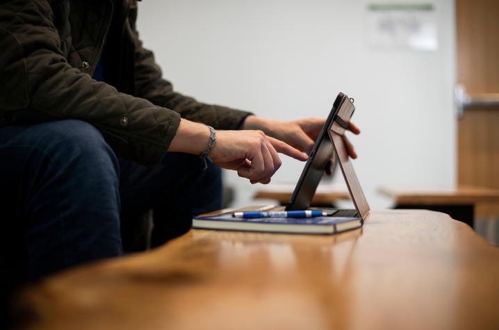 Student using an iPad.