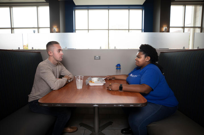 photo of two students eating together