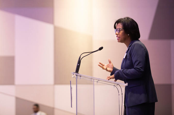 Photo of Sonja Feist-Price speaking in front of audience