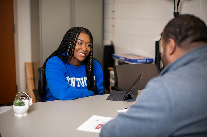 Photo of student meeting with peer