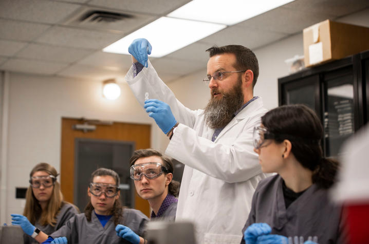 Lou Hirsch instructs students in a classroom