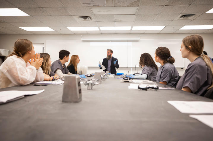 Lou Hirsch instructs students in a classroom