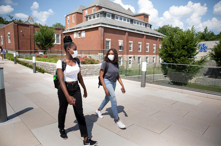photo of two students walking on campus