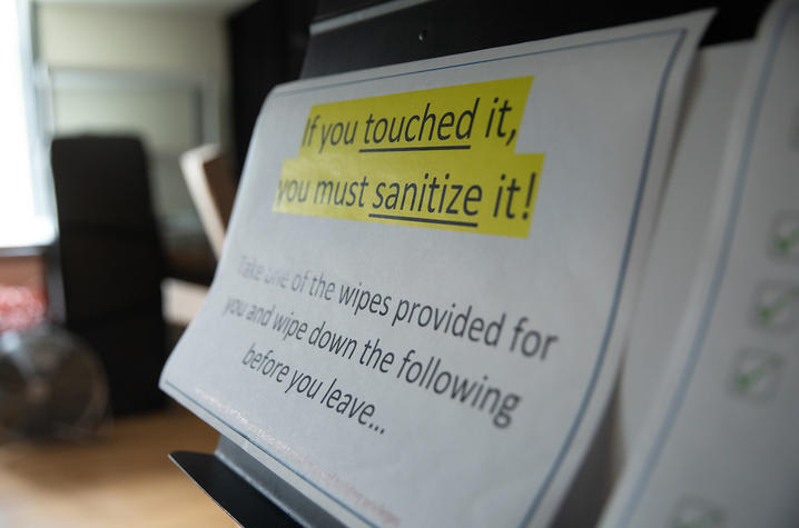 photo of posted reminder to sanitize classroom