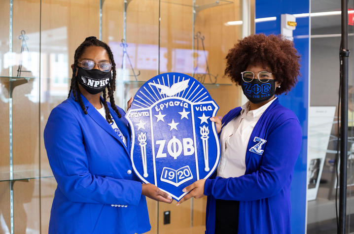  Members of Zeta Phi Beta Sorority, Inc. display their crest.